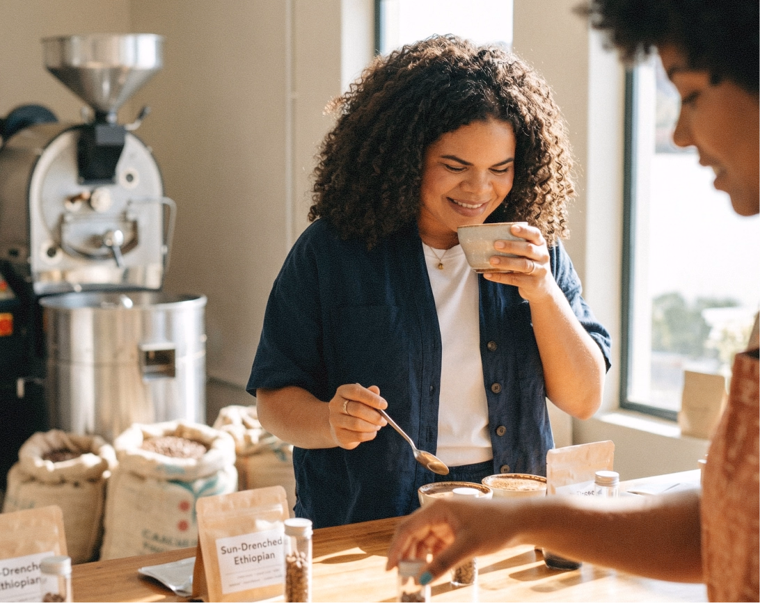 Two people talking over coffee.